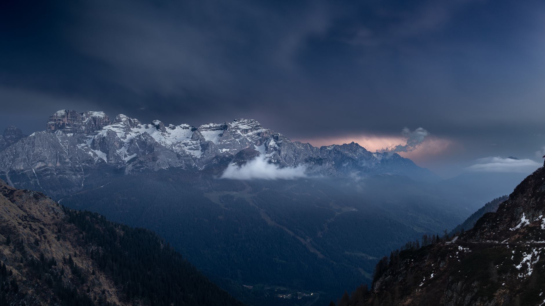 Captivating view of a thunderstorm rolling over the Italian Alps, showcasing nature's raw power.