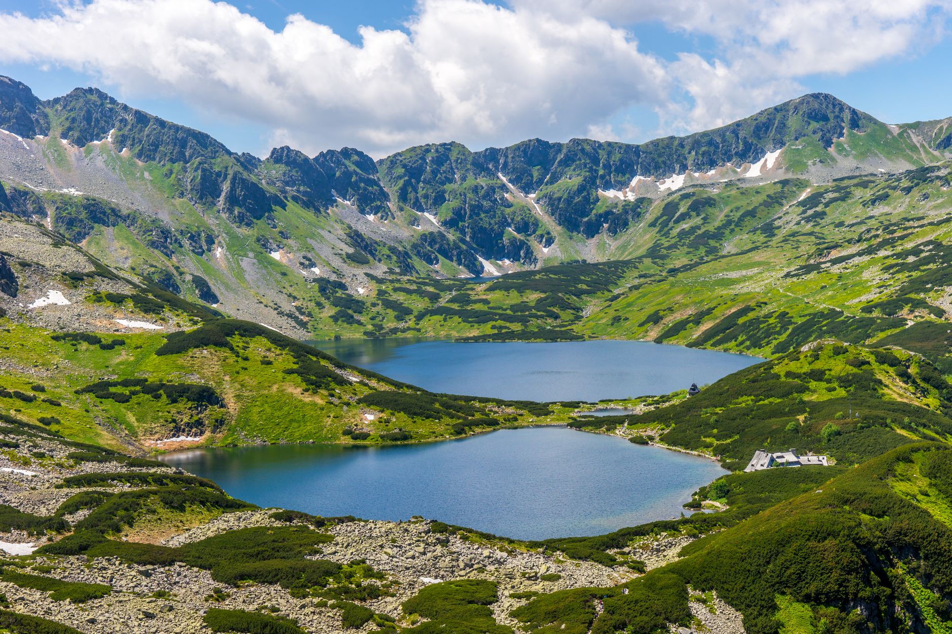 A breathtaking view of mountain lakes surrounded by lush greenery in Tatra National Park.
