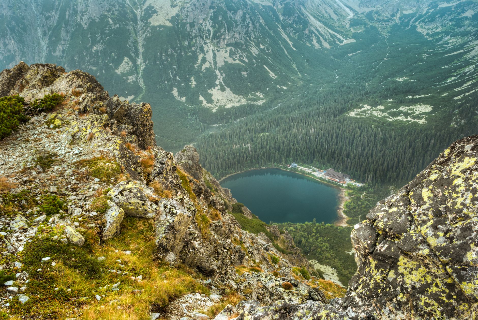 Breathtaking aerial view of Tatra Mountains and scenic mountain lake in Slovakia. Perfect travel destination.