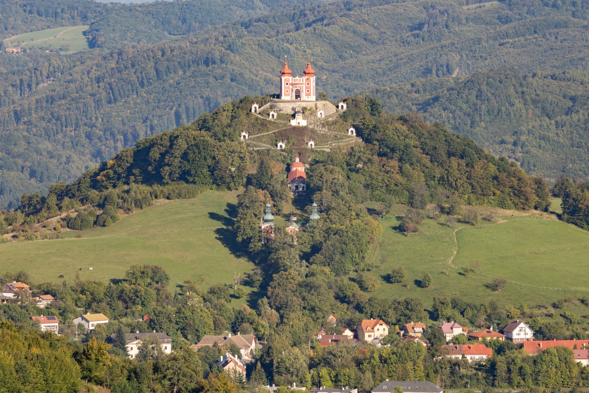 Aerial view of Banská Štiavnica Calvary, a Baroque chapel complex in Slovak mountains.