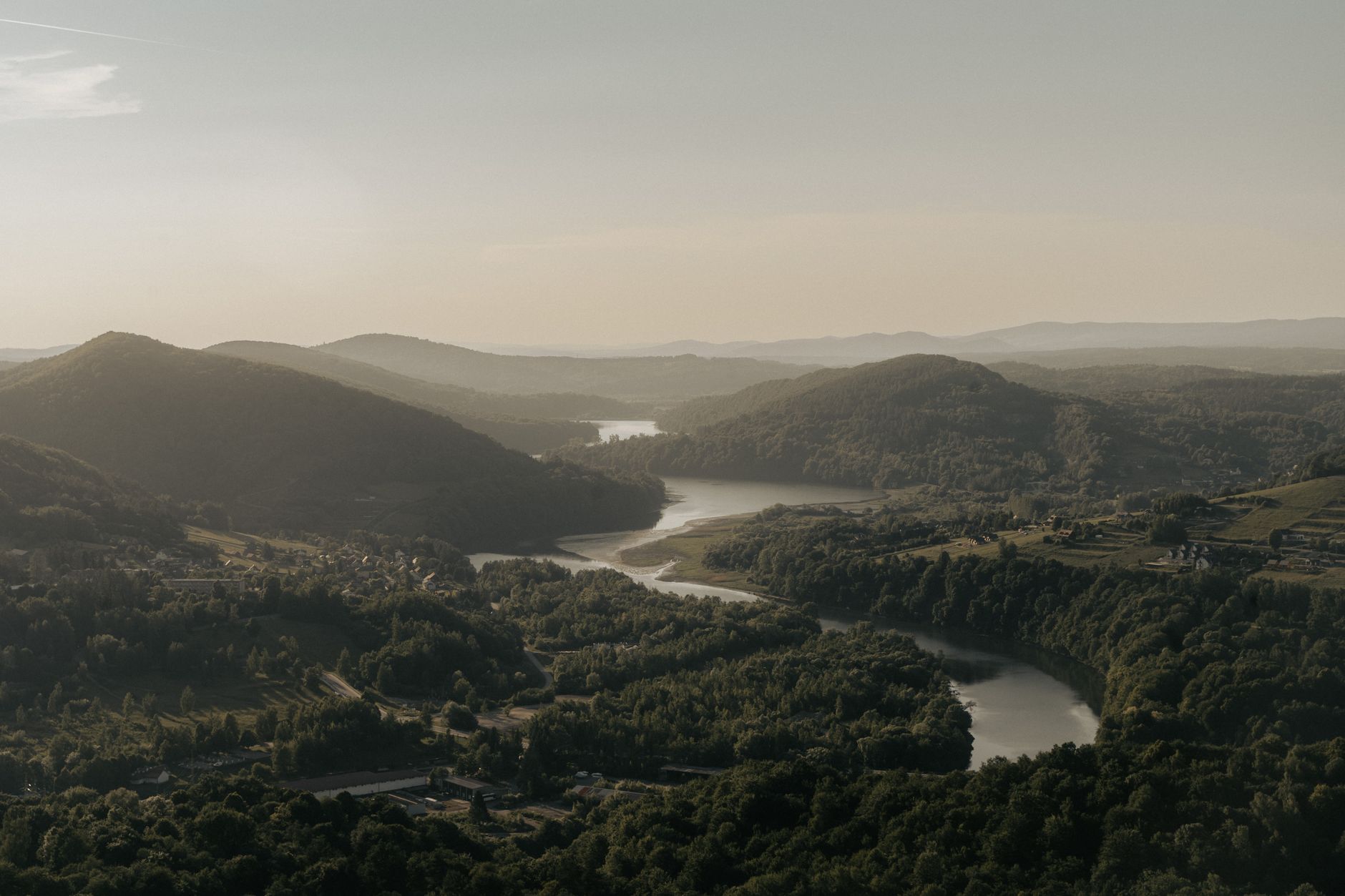 A breathtaking aerial view of Solina Lake and surrounding hills in Podkarpackie Voivodeship, Poland.