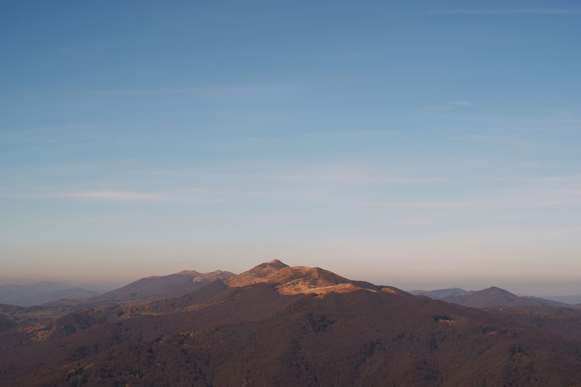 Stunning view of Bieszczady Mountains under a clear blue sky, perfect for nature lovers.
