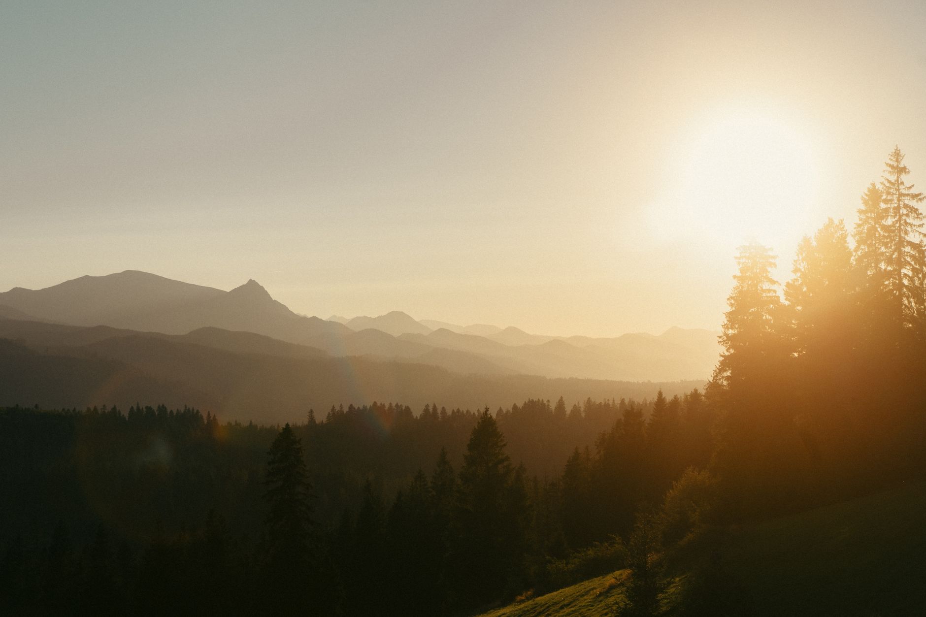 A breathtaking sunset over the Tatra Mountains in Zakopane, Poland, highlighting serene natural beauty.