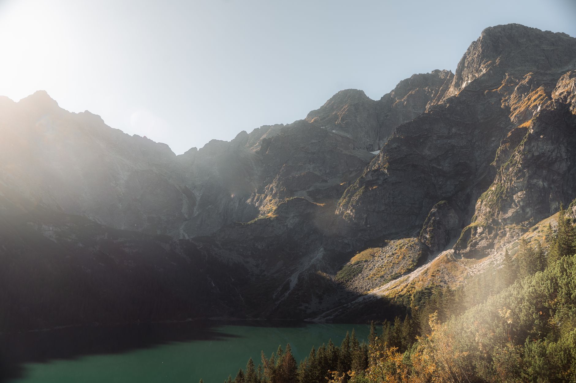 A stunning view of the Tatra Mountains in Zakopane, showcasing sunlight over majestic peaks.